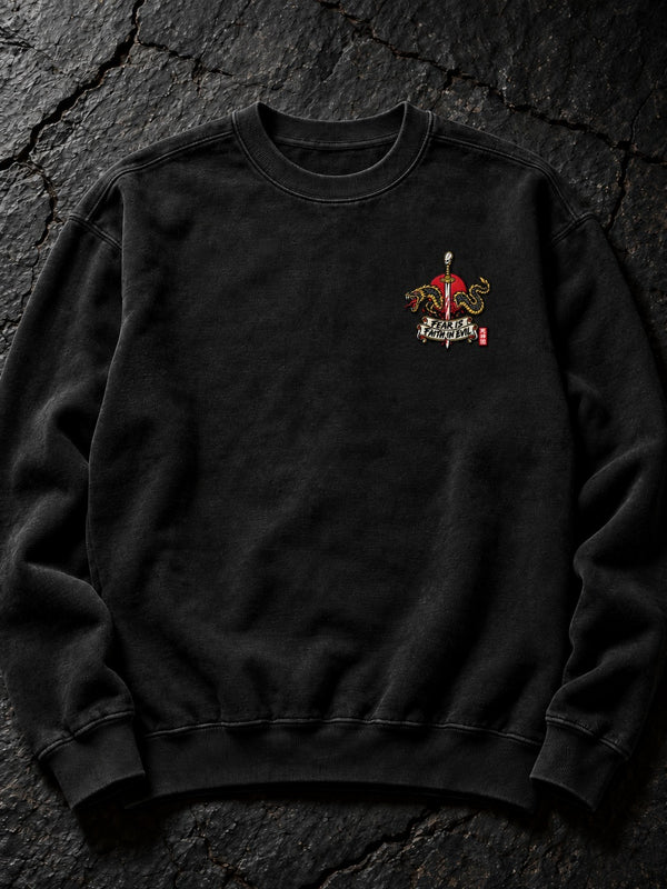 Embroidered Fear Is Faith in Evil left-chest logo (the only embroidered part) on the Pepper Nephilim Slayer Embroidered Sweatshirt