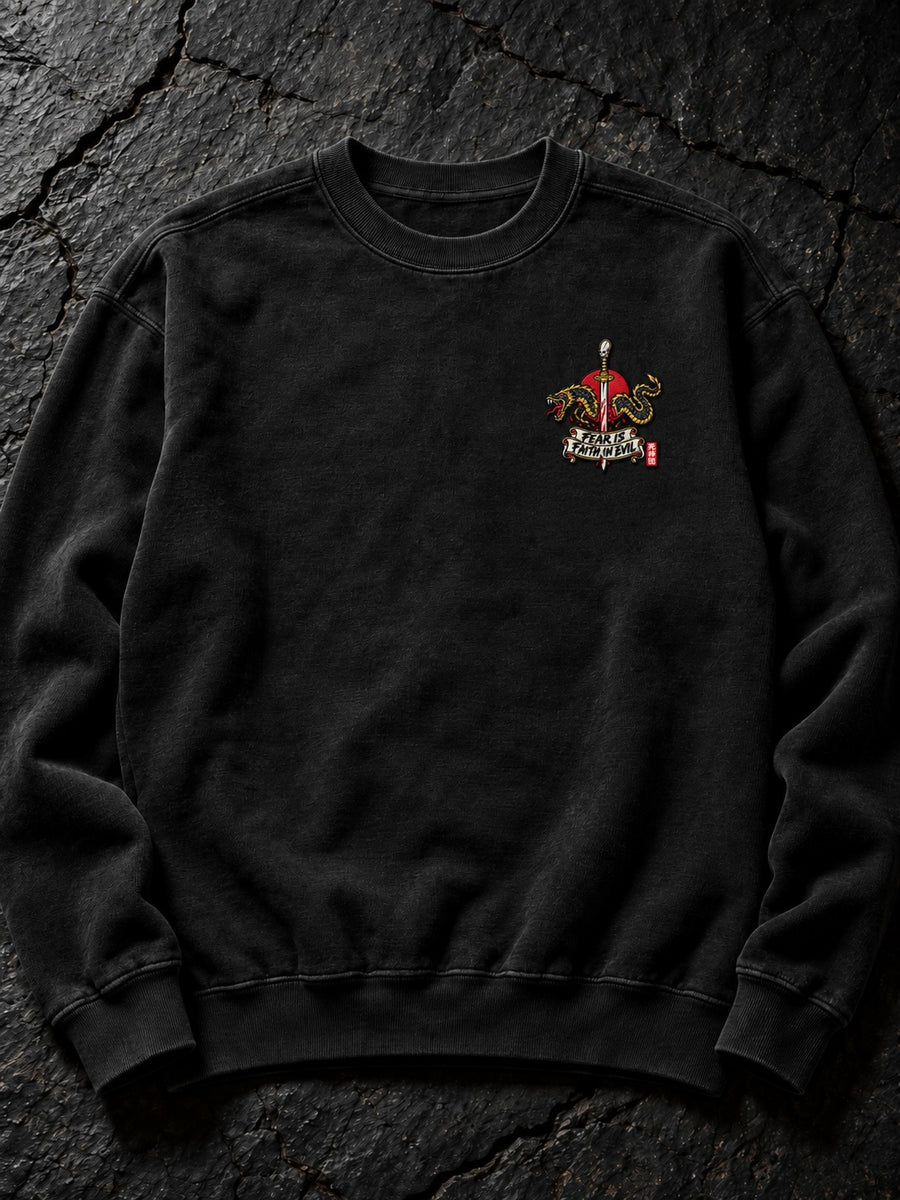 Embroidered Fear Is Faith in Evil left-chest logo (the only embroidered part) on the Pepper Nephilim Slayer Embroidered Sweatshirt