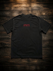 Straight Bible Daniel 2 graphic T-shirt in washed black, flat lay with red chest print