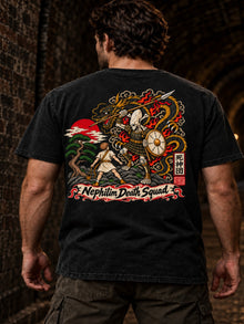 Model wearing the black Nephilim Slayer T-Shirt, showing the David vs Goliath giant-slayer back print