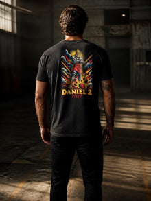 Man wearing the Straight Bible Daniel 2 graphic T-shirt showing the back print in a warehouse