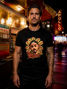 Man wearing The Raven Hotdogs graphic tee at a hot dog cart at night, Nephilim Death Squad podcast merch