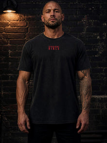 Model wearing the Straight Bible Daniel 2 graphic T-shirt in washed black, front view