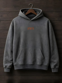 Straight Bible At Thy Word Tishbite 850 vs 1 hoodie in Pepper on a hanger against dark wood, front chest print