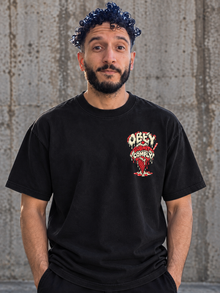 Black Obey Submit Comply graphic tee front mockup with chest print