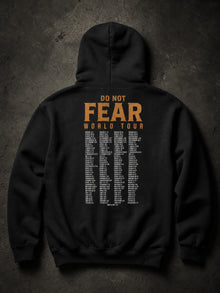 Back of the black Fear Not World Tour hoodie: orange DO NOT FEAR WORLD TOUR header over a tour-date list of Bible verse references