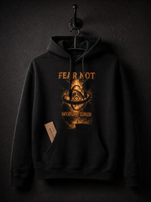 Black Fear Not World Tour hoodie by Nephilim Death Squad hanging on an iron hook, orange biblically accurate angel print on the front