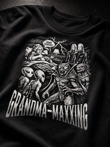 Close-up of the white Grandma-Maxxing comic print: shotgun-wielding grandma, DAMN DEMONS! speech bubble, aliens and demons around her bed