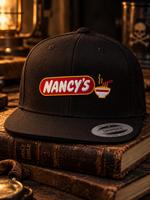 Nancy's Ramen Co. Embroidered Snapback: embroidery close-up of Nancy's oval and ramen bowl