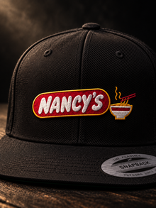 Nancy's Ramen Co. Embroidered Snapback: black YP Classics 6089M three-quarter lifestyle, embroidered logo