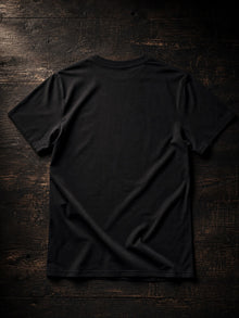 Back view of the black NDS Youth Group Summer Camp 2025 T-shirt, plain back with the youth-camp parody print on the front only