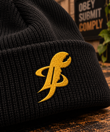 Close-up of TopLobsta black ribbed beanie, yellow TL claw embroidery on cuff
