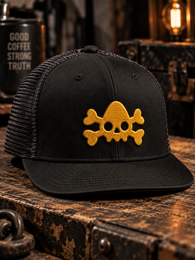 Black Nephilim Death Squad trucker hat with yellow embroidered skull logo, flat lay