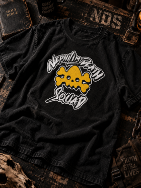 Black NDS logo tee with yellow skull and white Nephilim Death Squad lettering, flat lay