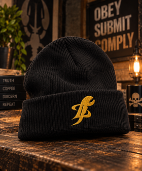 Black TopLobsta logo beanie with yellow embroidered claw on cuff, wood table flat lay