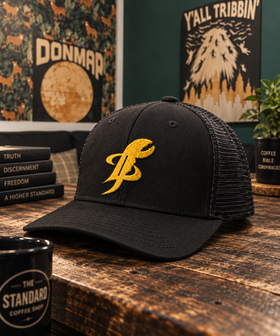 TopLobsta logo trucker hat, front yellow embroidery, lifestyle flat lay