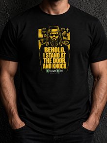 Man wearing black Behold, I Stand at the Door T-Shirt by Straight Bible, yellow Jesus figure with Hebrew YHWH and Shalom
