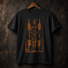 Black Shroud of Turin T-Shirt by Nephilim Death Squad: distressed orange shroud print, hung on a hanger, editorial shot
