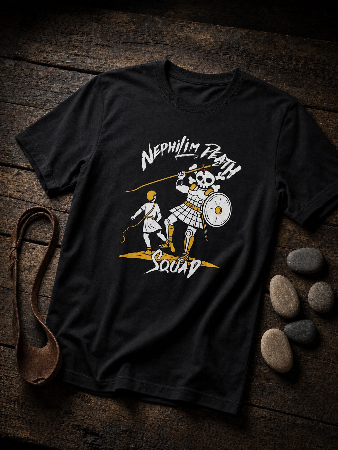 Black Skull of Goliath David vs. Goliath T-shirt by Nephilim Death Squad styled with a leather sling and five smooth stones