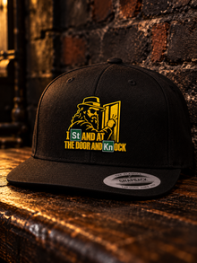 Stand at the Door Embroidered Snapback: embroidery close-up of St/Kn periodic-table knock design