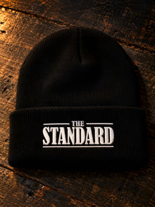 The Standard embroidered black cuffed beanie with white THE STANDARD wordmark
