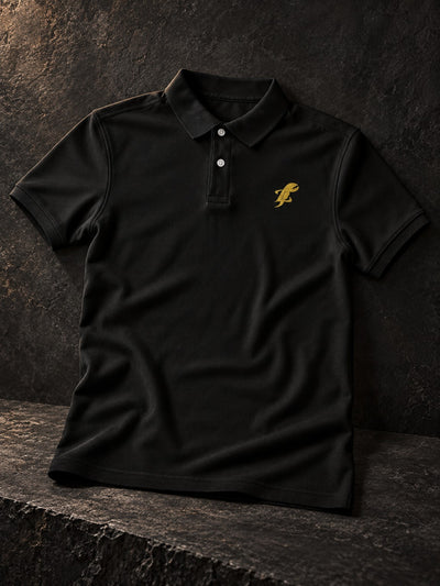 TopLobsta black polo shirt with gold embroidered lobster logo – editorial product view