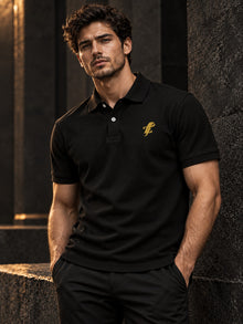 Model wearing TopLobsta black embroidered logo polo shirt