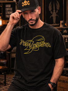 Man wearing the black TopLobsta Logo T-shirt and TopLobsta hat