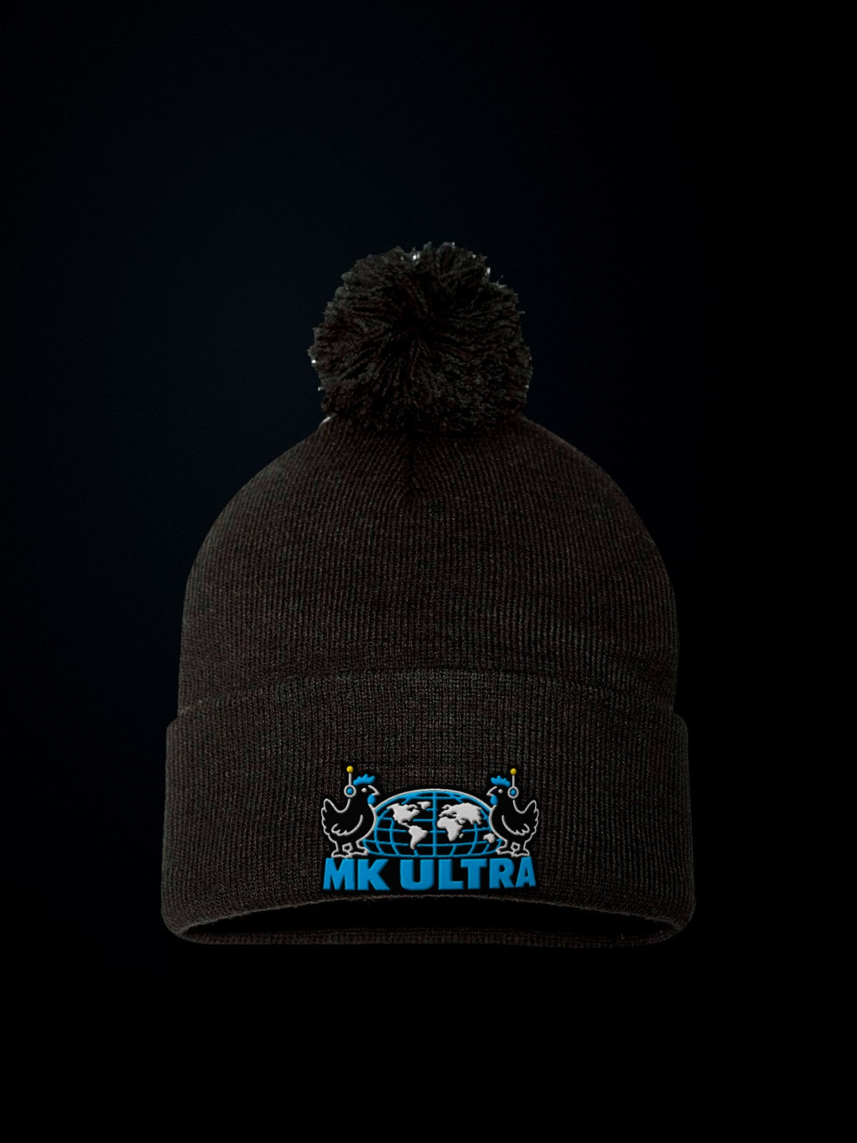 Worldwide MK Ultra Free-Range Chickens Pom-Pom Beanie: black Sportsman SP15 pom-pom beanie front view, embroidered MK Ultra headset chickens and globe
