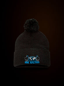 Worldwide MK Ultra Free-Range Chickens Pom-Pom Beanie: black Sportsman SP15 pom-pom beanie front view, warm light, embroidered MK Ultra headset chickens and globe