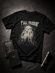 Black Y'all Tribbin' tribulation parody T-shirt styled flat lay with a prophecy paperback, pocket Bible and flashlight